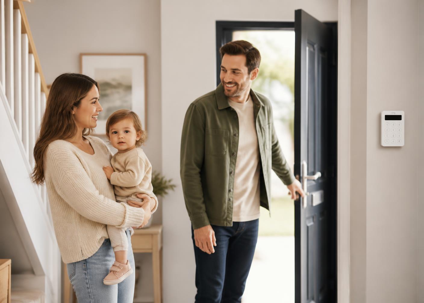 Family arriving home past a wireless Ajax keypad in the hallway